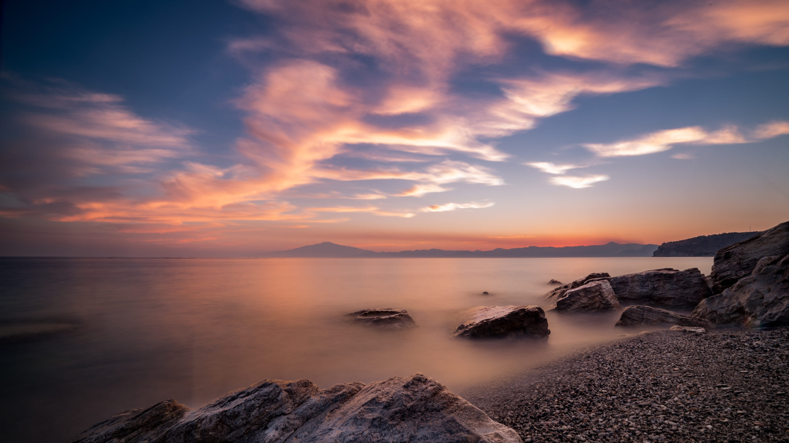 Beautiful seascape at sunset with rock formations in the water The beautiful seascape at sunset with rock formations in the water